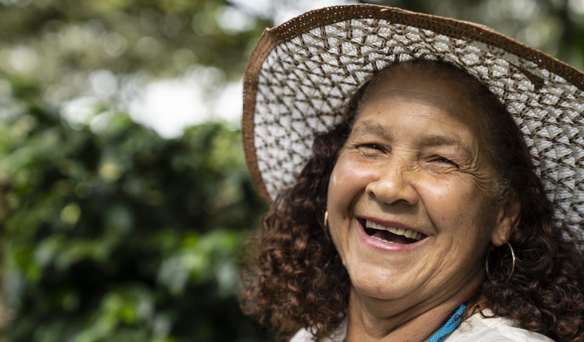 smiling coffee worker in Colombia