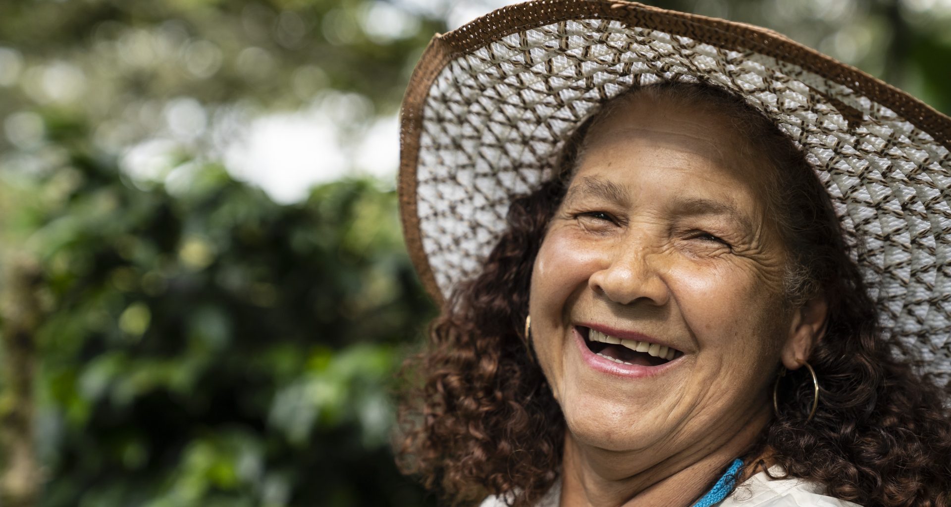 smiling coffee worker in Colombia