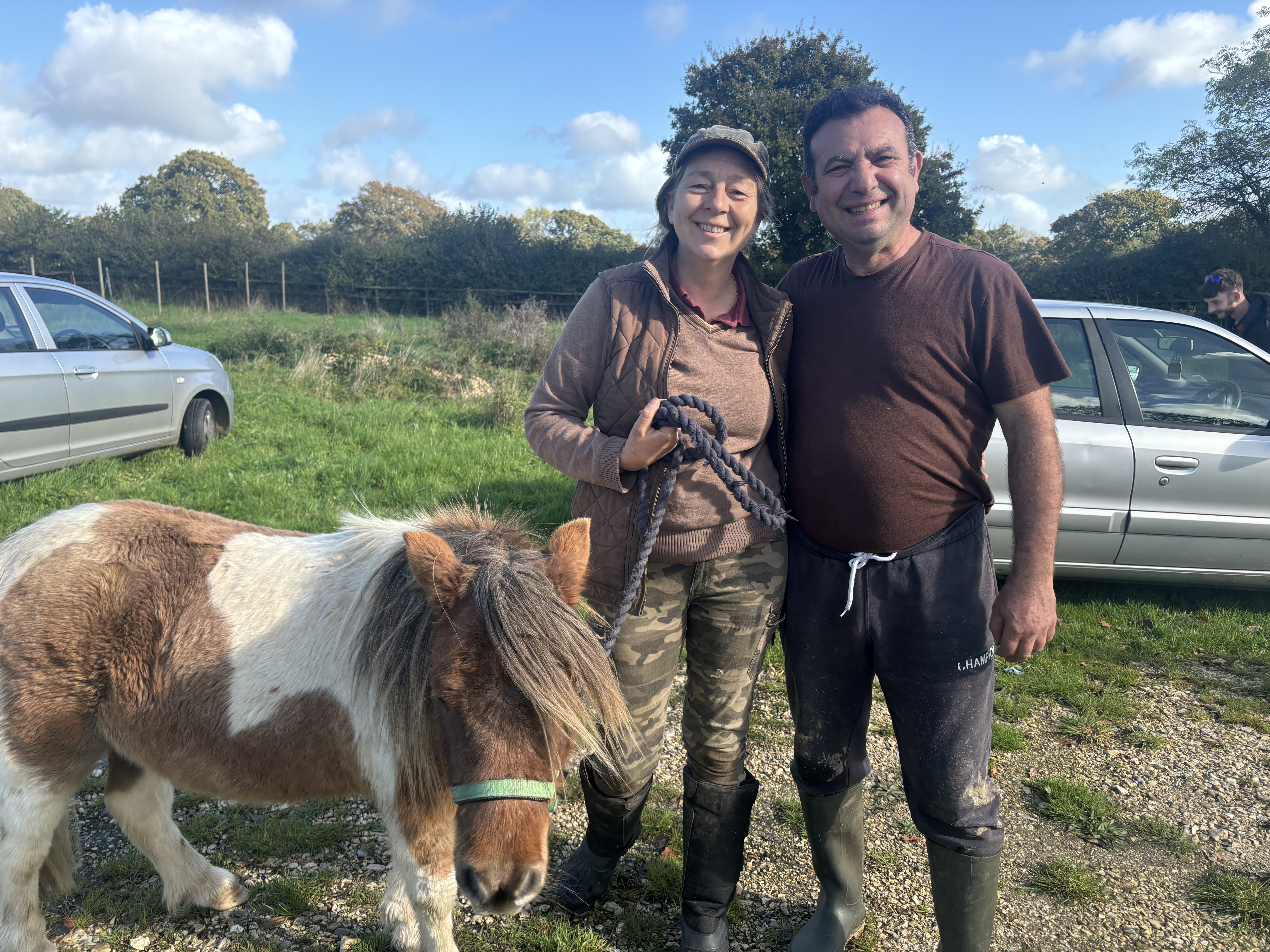 man and woman and Shetland pony